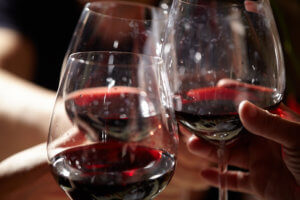 Three red wine glasses.